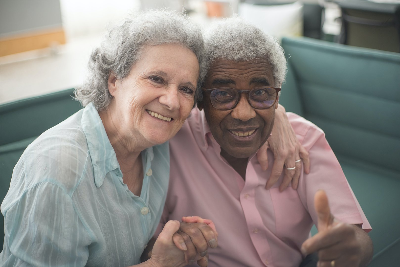 Woman embracing a man with dementia