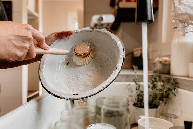 Simply washing up is a stimulating activity for care home residents to enjoy.